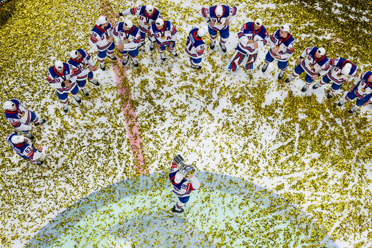 Drew O'Connor of USA celebrates with the trophy in front of