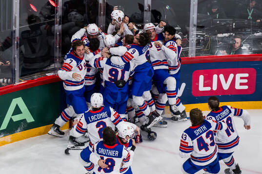 Tage Thompson of USA celebrates with team mates