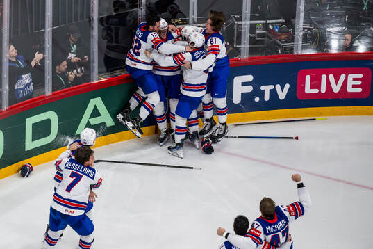 Tage Thompson of USA celebrates with team mates