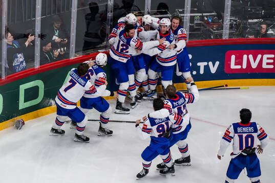 Tage Thompson of USA celebrates with team mates