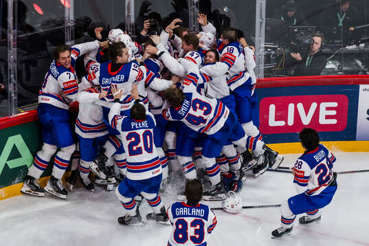 Tage Thompson of USA celebrates with team mates