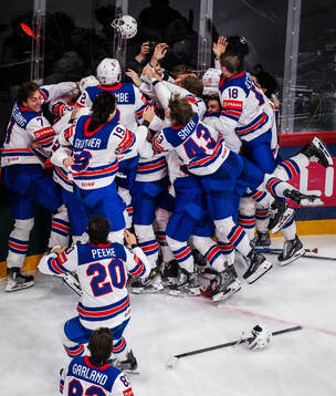 Tage Thompson of USA celebrates with his teammates