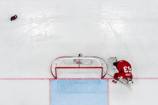 Goaltender Leonardo Genoni of Switzerland looks dejected