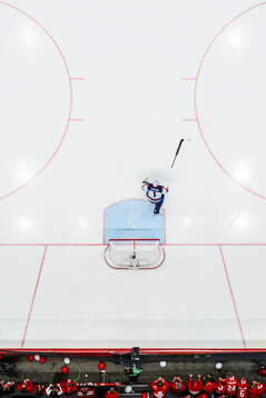 Goaltender Jeremy Swayman of USA celebrates the team’s