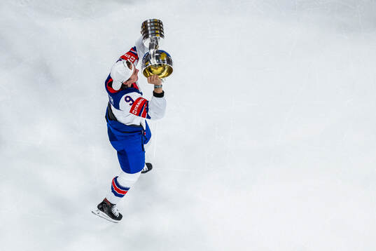 Clayton Keller of USA hoists the winner’s trophy