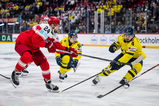 Nikolaj Ehlers of Denmark competes for the puck with Jesper