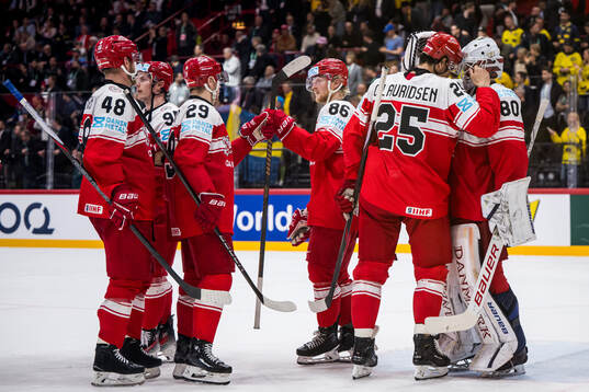 goaltender Frederik Dichow of Denmark looks dejected with