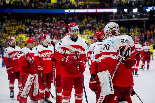 goaltender Frederik Dichow of Denmark looks dejected with