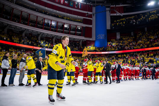 Mika Zibanejad and Erik Gustafsson of Sweden greets players