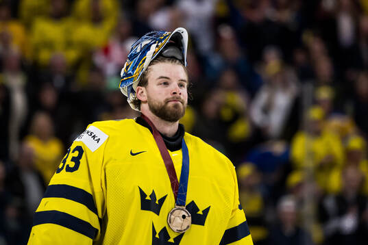 goaltender Samuel Ersson of Sweden with his bronze medal
