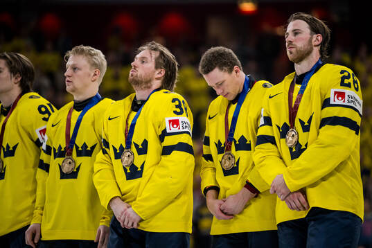 Rasmus Sandin, Lucas Raymond, and Elias Lindholm of Sweden