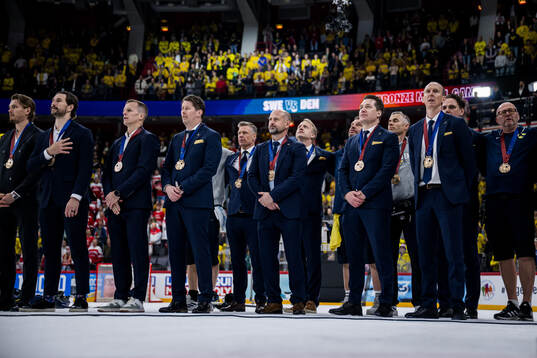 Head coach Sam Hallam with his bronze medal