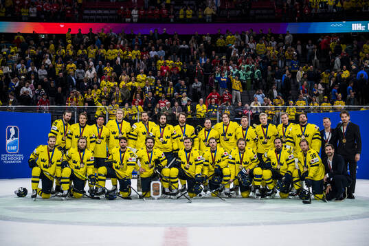 The players of Sweden pose for a bronze medal picture