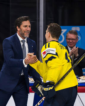 Henrik Lundqvist congratulates Mikael Backlund of Sweden