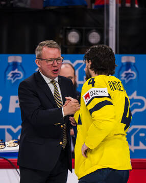 Rasmus Andersson of Sweden receives his bronze medal from