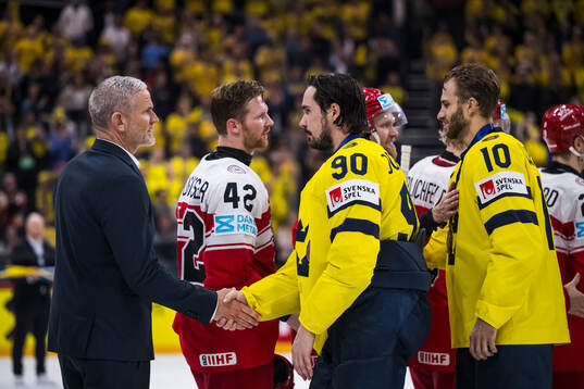 Head coach Mikael Gath and Phillip Bruggisser of Denmark