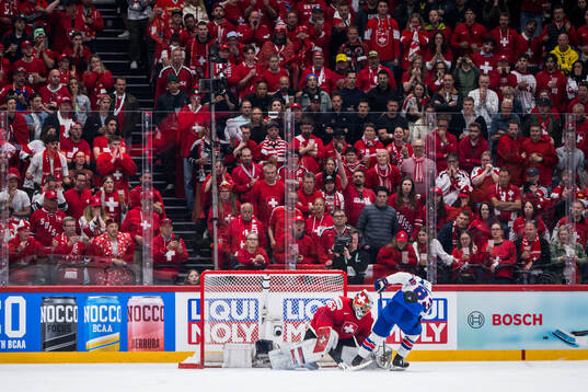 goaltender Leonardo Genoni of Switzerland saves a penalty
