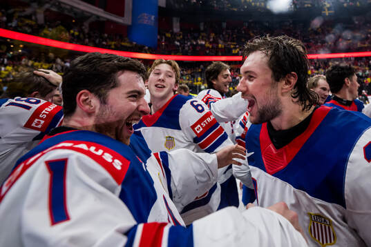 goaltender Jeremy Swayman and Andrew Peeke of USA