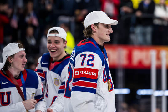 Tage Thompson of USA celebrates with his gold medal