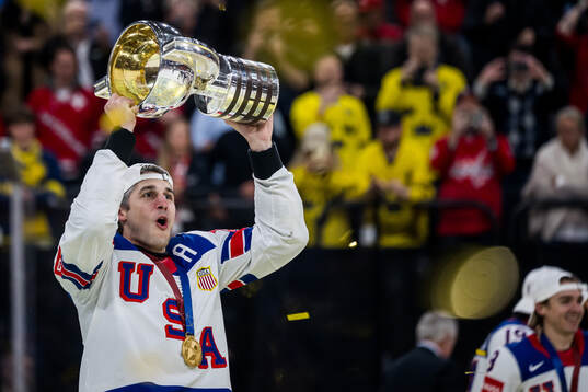 Brady Skjei of USA celebrates with t he trophy