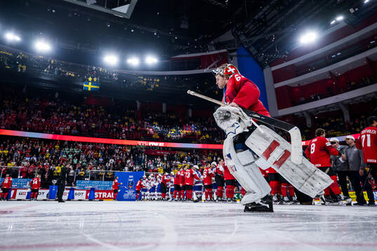 Goaltender Leonardo Genoni of Switzerland looks dejected