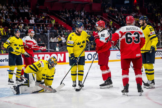 Goaltender Samuel Ersson and Adam Larsson with Jonas