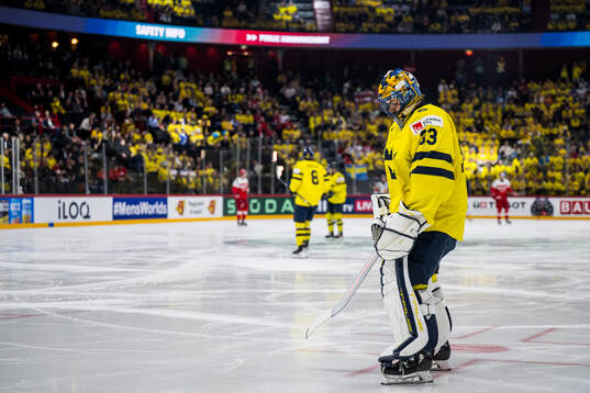 Goaltender Samuel Ersson of Sweden looks dejected