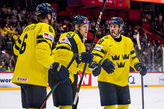 Adam Larsson, Emil Heineman and Elias Lindholm of Sweden