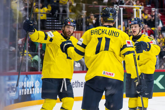 Mikael Backlund and Emil Heineman of Sweden celebrate