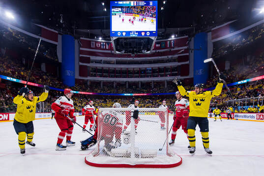 Emil Heineman and Mikael Backlund of Sweden celebrate the