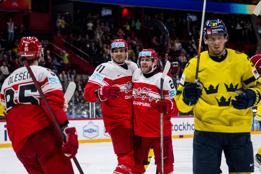 Alexander True and Nikolaj Ehlers of Denmark celebrate