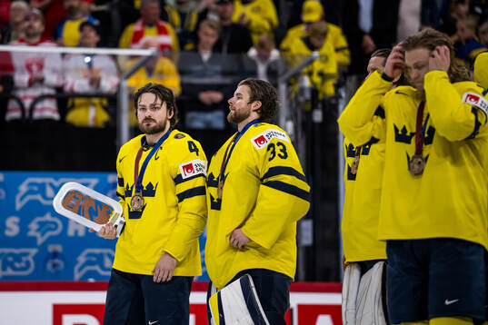 Rasmus Andersson of Sweden with the trophy for third place