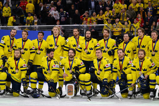 Players of Sweden celebrate with the bronze trophy