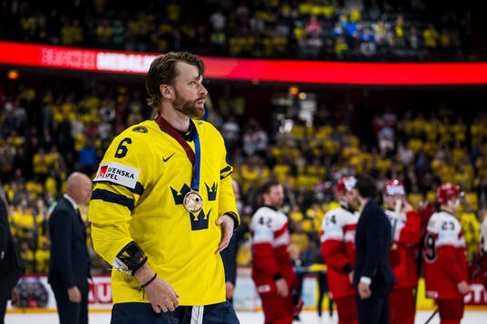 Adam Larsson  of Sweden with the bronze medal
