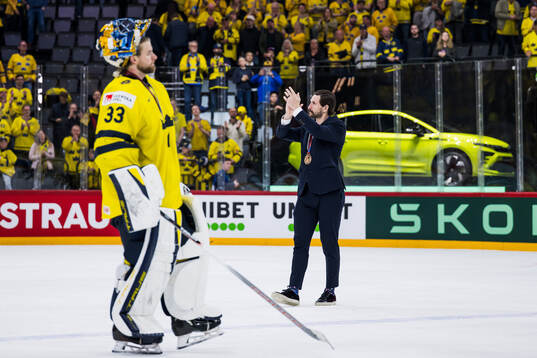 Goaltender Samuel Ersson and Filip Forsberg of Sweden with