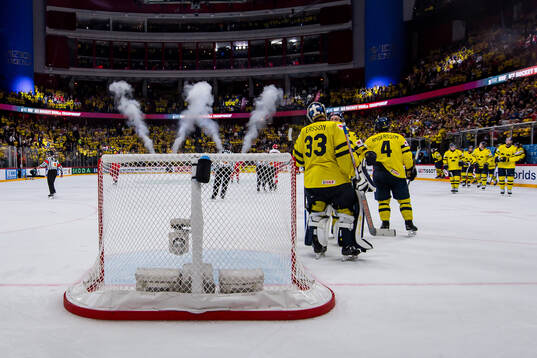 goaltender Samuel Ersson of Sweden with team mates