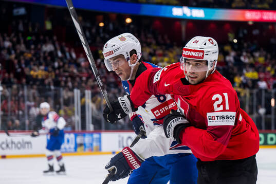 Zach Werenski of USA and Kevin Fiala of Switzerland