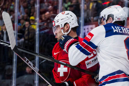 Timo Meier of Switzerland and Zach Werenski of USA