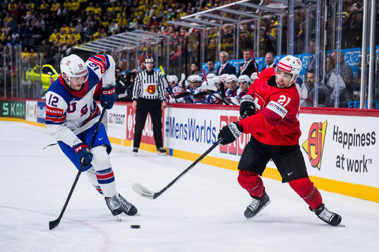 Shane Pinto of USA and Kevin Fiala of Switzerland