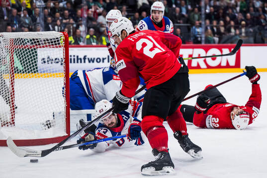 Conor Garland of USA and Kevin Fiala of Switzerland