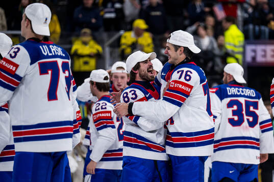 Conor Garland and Brady Skjei of USA celebrate aftetr