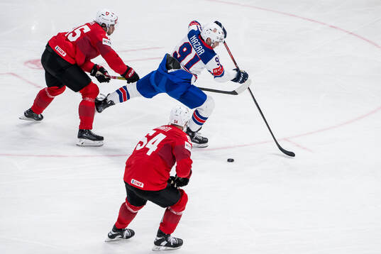 Michael Fora of Switzerland with a hooking against Frank