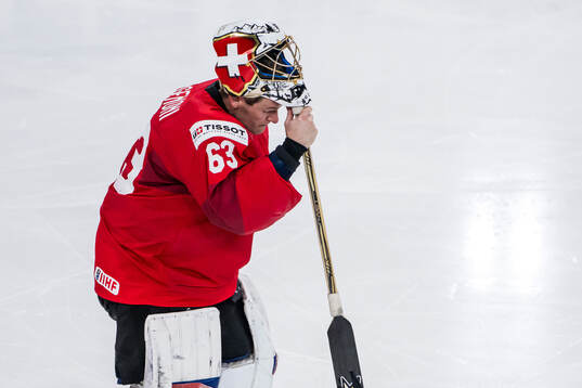 Goaltender Leonardo Genoni of Switzerland looks dejected