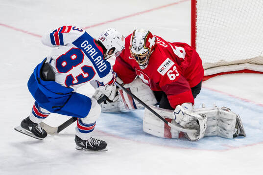 Goaltender Leonardo Genoni of Switzerland saves a penalty