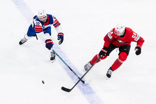Matty Beniers of USA and Christian Marti of Switzerland