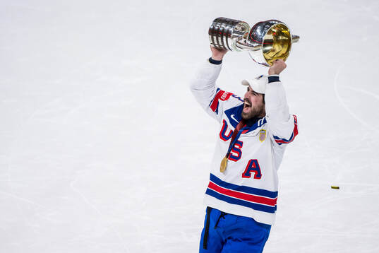 Zach Werenski of USA celebrates with the trophy