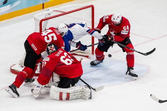 Michael Fora, goaltender Leonardo Genoni and Christian