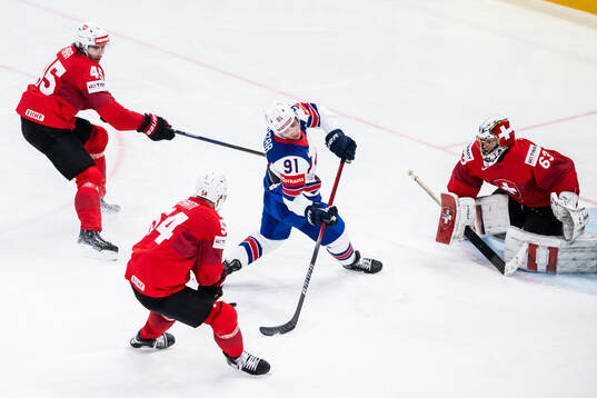 Michael Fora of Switzerland with a hooking against Frank
