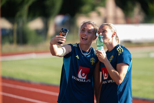 Goalkeeper Jennifer Falk and Jonna Andersson of the Swedish