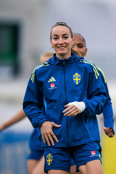 Madelen Janogy and Kosovare Asllani of the Swedish